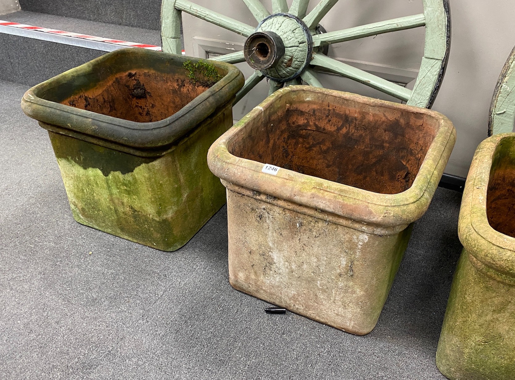 Four terracotta pots with lion's paw feet (two feet missing), width 46cm, height 38cm